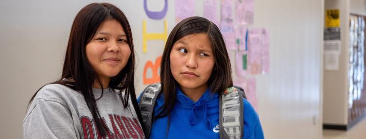Two studens in the hallway at Riverside Indian School