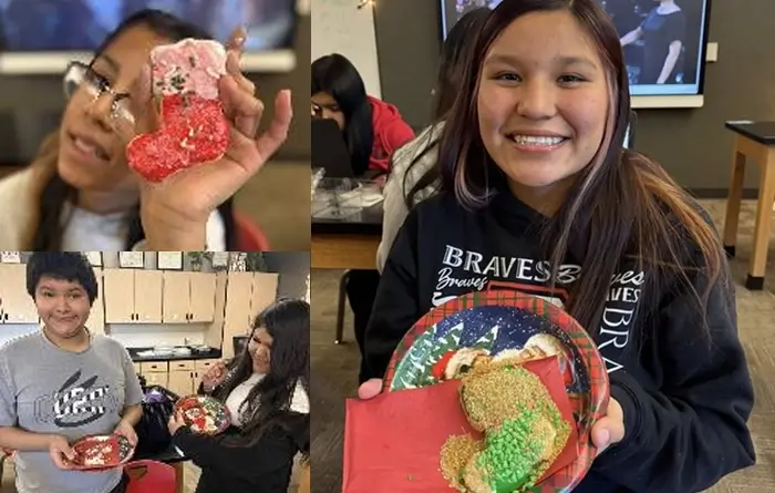 Students decorating Christmas cookies